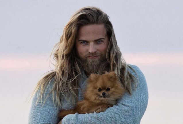 real life thor poses with floofy pom melts loins everywhere