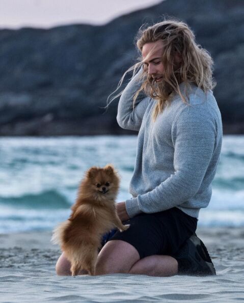 real life thor poses with floofy pom melts loins everywhere