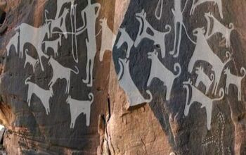 Ancient Engravings Show Early Dogs Were Leashed Companions