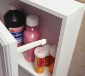 these common household dangers could harm your dog, Medicine cabinet image via Canva