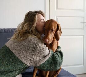 can your pets catch your cold, Woman cuddling dog image via Canva