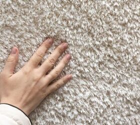 Hand on carpet - image via Canva